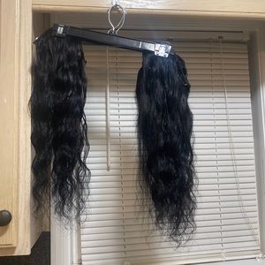 Two bundles black human hair clip in extensions 20 inches.